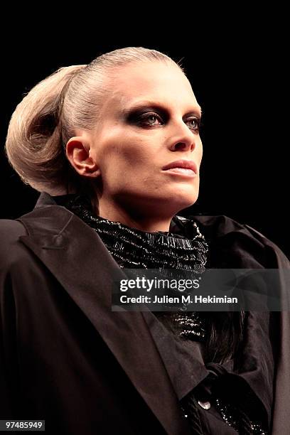 Model walks the runway during the Viktor & Rolf Ready to Wear Show as part of the Paris womens wear Fashion Week Fall Winter 2011 at Espace Ephemere...