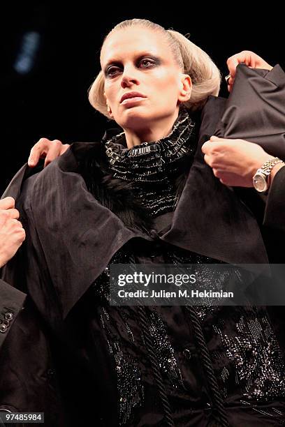 Model walks the runway during the Viktor & Rolf Ready to Wear Show as part of the Paris womens wear Fashion Week Fall Winter 2011 at Espace Ephemere...