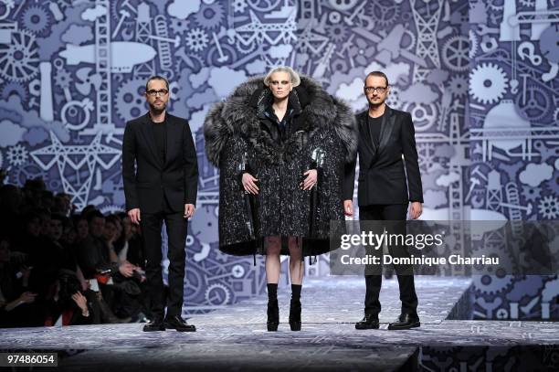 Designers Viktor & Rolf and model Kristen McMenamy perform during the Viktor & Rolf Ready to Wear Show as part of the Paris womens wear Fashion Week...