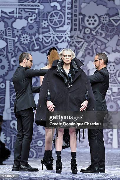 Designers Viktor & Rolf and model Kristen McMenamy perform during the Viktor & Rolf Ready to Wear Show as part of the Paris womens wear Fashion Week...