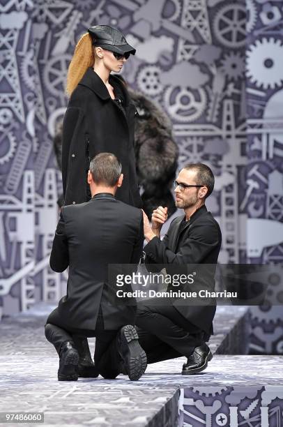 Designers Viktor & Rolf and model perform during the Viktor & Rolf Ready to Wear Show as part of the Paris womens wear Fashion Week Fall Winter 2011...