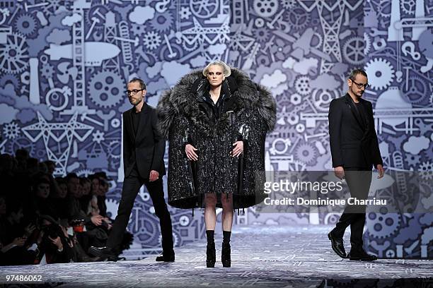 Designers Viktor & Rolf and model Kristen McMenamy perform during the Viktor & Rolf Ready to Wear Show as part of the Paris womens wear Fashion Week...