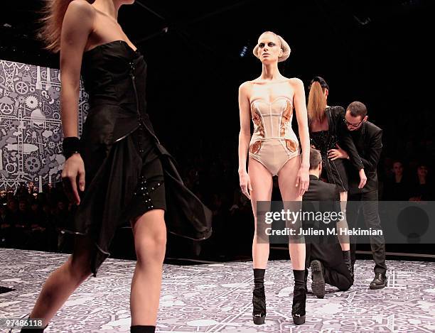 Model Kristen McMenamy performs during the Viktor & Rolf Ready to Wear Show as part of the Paris womens wear Fashion Week Fall Winter 2011 at Espace...