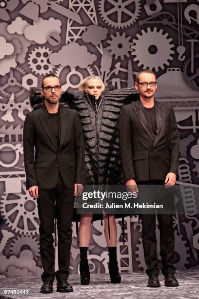 Designers Viktor & Rolf pose with model Kristen McMenamy during the Viktor & Rolf Ready to Wear show as part of the Paris Womenswear Fashion Week...