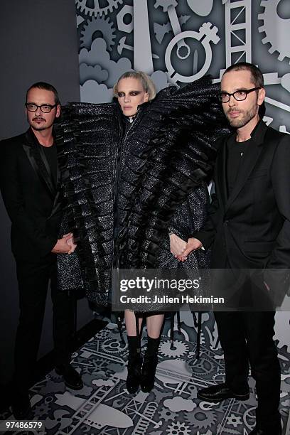 Designers Viktor & Rolf pose backstage with model Kristen McMenamy during the Viktor & Rolf Ready to Wear show as part of the Paris Womenswear...