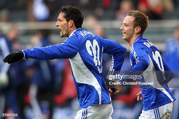 Ivan Rakitic of Schalke celebrates the third goal with Kevin Kuranyi of Schalke during the Bundesliga match between Eintracht Frankfurt and FC...