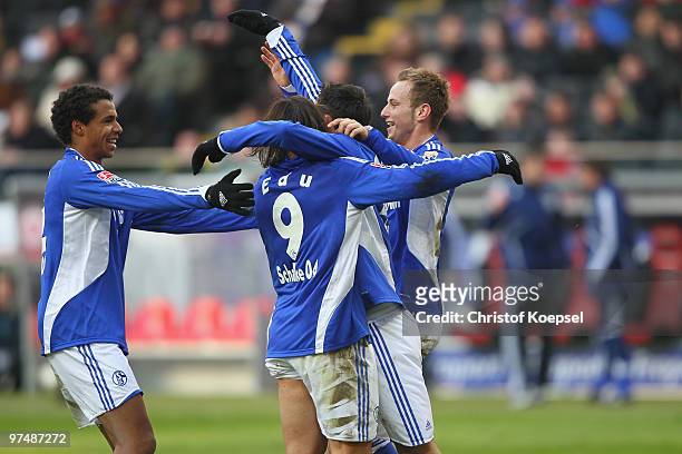 Ivan Rakitic of Schalke celebrates the third goal with Joel Matip of Schalke , Edu and Kevin Kuranyi of Schalke during the Bundesliga match between...