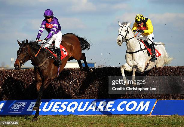 Barry Geraghty riding Big Fella Thanks jumps the final hurdle with Ruby Walsh riding Pasco to win The Raymond Mould Supporting Greatwood Gold Cup...