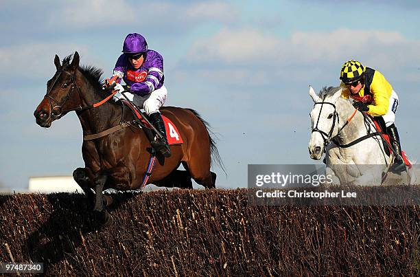 Barry Geraghty riding Big Fella Thanks jumps the final hurdle with Ruby Walsh riding Pasco to win The Raymond Mould Supporting Greatwood Gold Cup...