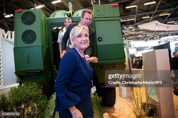 French Member of Parliament and president of the French far-right Rassemblement National party Marine Le Pen visits at the Eurosatory 2018 Show, on...