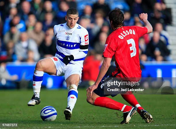Adel Taarabt of QPR fools Jonas Olsson of West Bromwich Albion during the Coca Cola Championship match between Queens Park Rangers and West Bromwich...