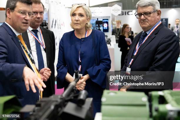 French Member of Parliament and president of the French far-right Rassemblement National party Marine Le Pen visits at the Eurosatory 2018 Show, on...