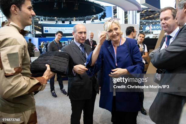 French Member of Parliament and president of the French far-right Rassemblement National party Marine Le Pen visits at the Eurosatory 2018 Show, on...