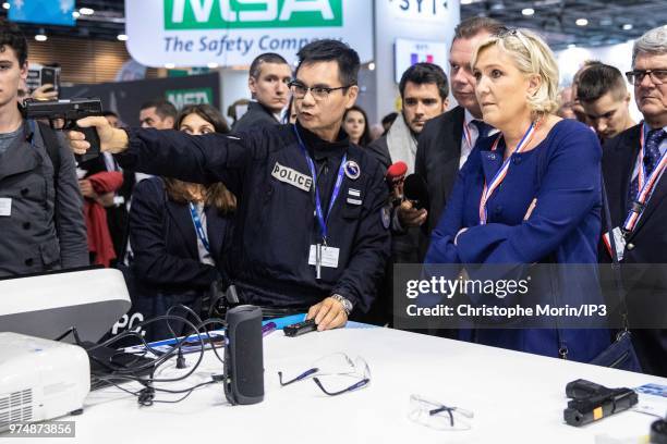 French Member of Parliament and president of the French far-right Rassemblement National party Marine Le Pen visits at the Eurosatory 2018 Show, on...