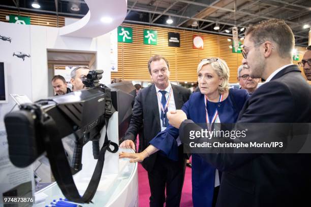 French Member of Parliament and president of the French far-right Rassemblement National party Marine Le Pen visits at the Eurosatory 2018 Show, on...