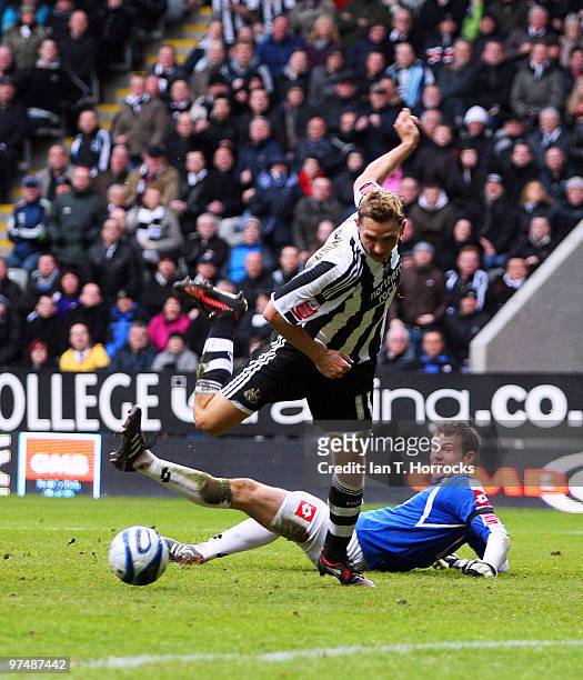 Peter Lovenkrands of Newcastle is tripped by Barnsley goalkeeper Luke Steele leading to the keeper being sent off and Newcastle's first goal from the...