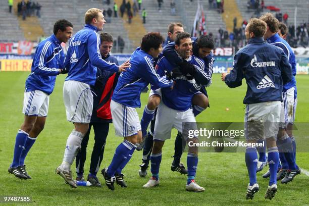 The team of Schalke celebrates the 4:1 victory after the Bundesliga match between Eintracht Frankfurt and FC Schalke at the Commerzbank Arena on...