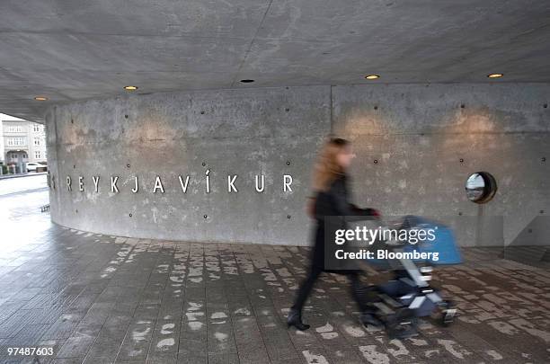 Woman enters a polling station to vote in the Icelandic national referendum in Reykjavik, Iceland, on Saturday, March 6, 2010. Icelanders are voting...