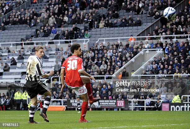 Peter Lovenkrands of NewcastleUnited scores the second goal during the Coca-Cola championship match between Newcastle United and Barnsley at St...