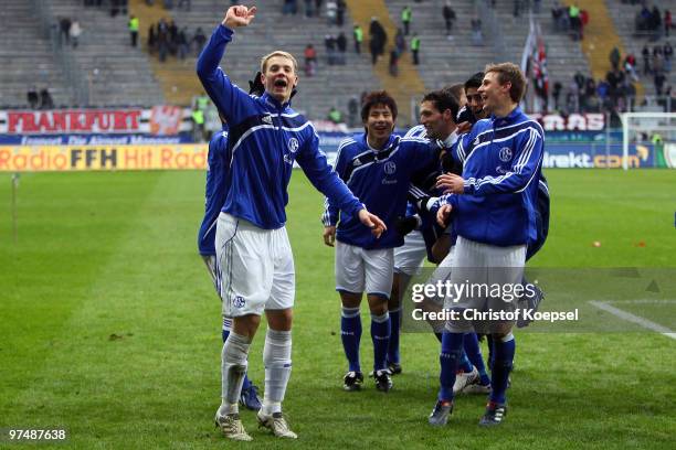 Manuel Neuer, Hao Junmin, Kevin Kuranyi and Benedikt Hoewedes of Schalke celebrates the 4:1 victory after the Bundesliga match between Eintracht...