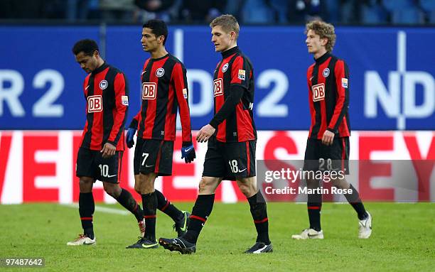 Raffael, Cicero, Artur Wichniarek and Fabian Lustenberger of Berlin walk off dejected after the Bundesliga match between Hamburger SV and Hertha BSC...