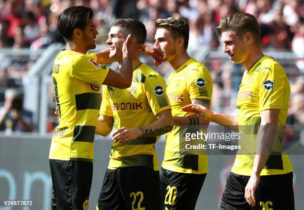Christian Pulisic of Dortmund celebrates after scoring his team`s first goal with Mahmoud Dahoud of Dortmund, Maximilian Philipp of Dortmund and...