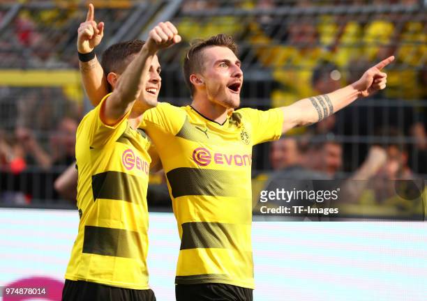 Maximilian Philipp of Dortmund celebrates after scoring his team`s third goal with Christian Pulisic of Dortmund during the Bundesliga match between...