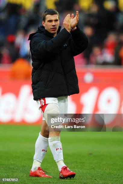 Lukas Podolski of Koeln celebrates after the Bundesliga match between 1. FC Koeln and FC Bayern Muenchen at RheinEnergieStadion on March 6, 2010 in...