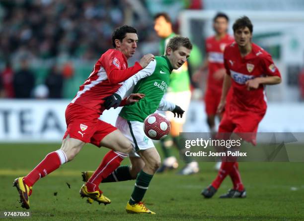 Marko Marin of Bremen and Roberto Hilbert of Stuttgart compete for the ball during the Bundesliga match between Werder Bremen and VfB Stuttgart at...