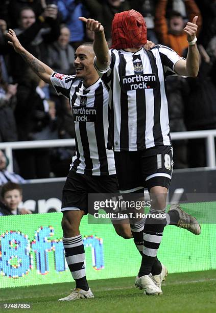 Jonas Gutierrez dons his Spider Man mask after he scored the fourth goal during the Coca-Cola championship match between Newcastle United and...