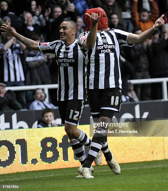 Jonas Gutierrez dons his Spider Man mask after he scored the fourth goal during the Coca-Cola championship match between Newcastle United and...