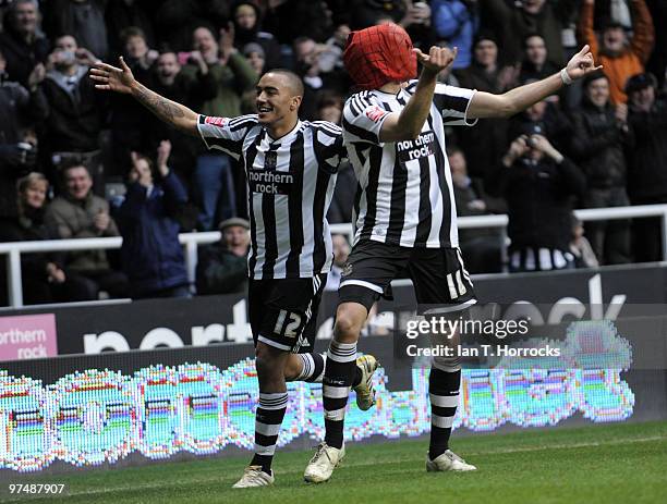 Jonas Gutierrez dons his Spider Man mask after he scored the fourth goal during the Coca-Cola championship match between Newcastle United and...