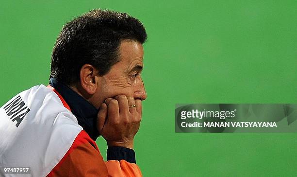 Indian hockey coach Jose Brasa looks on following the loss to England during their World Cup 2010 match at the Major Dhyan Chand Stadium in New Delhi...