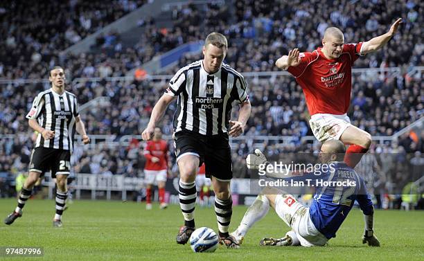 Kevin Nolan rounding stand in keeper David Preece to score the sixth goal during the Coca-Cola championship match between Newcastle United and...