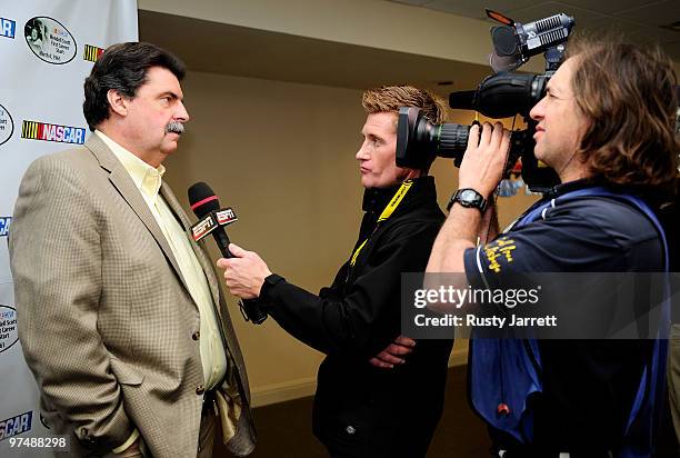 President Mike Helton speaks with ESPN television personality Marty Smith during the Wendell Scott press conferenceat Atlanta Motor Speedway on March...