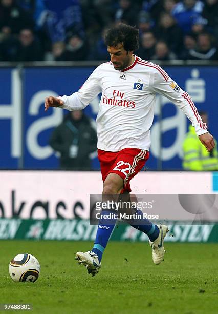 Ruud van Nistelrooy of Hamburg runs with the ball during the Bundesliga match between Hamburger SV and Hertha BSC Berlin at HSH Nordbank Arena on...