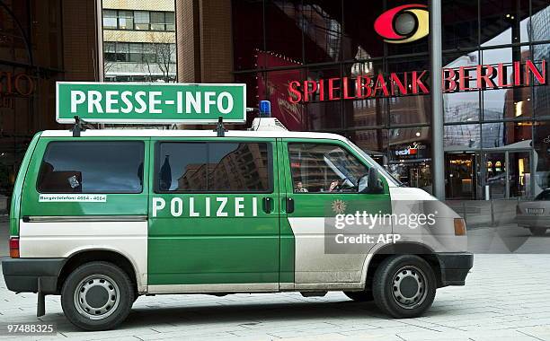 Police press information vehicle is parked in front of the "Spielbank" casino at Potsdamer Plarz in Berlin on March 6, 2010. Armed robbers raided a...