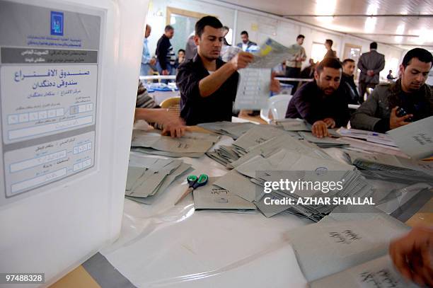 Electoral officials count the ballots of Anbar province soldiers and policemen, who voted two days ahead of the March 7 Iraqi general election, in...