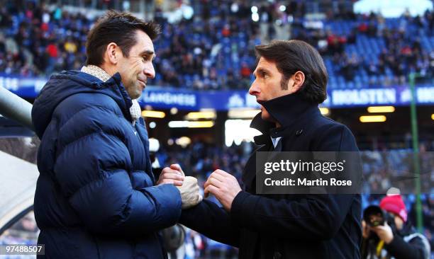 Michael Preetz , sport director of Berlin shake hands with Hamburg's head coach Bruno Labbadia prior to the Bundesliga match between Hamburger SV and...