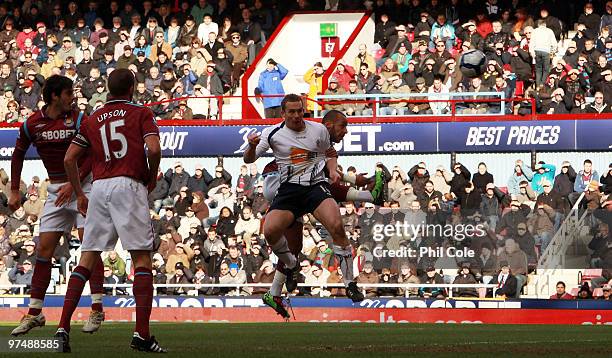 Kevin Davies of Bolton Wanderers scores the opening goal during the Barclays Premier League match between West Ham United and Bolton Wanderers at...