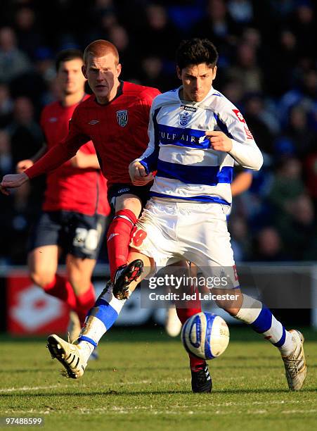 Ben Watson of West Bromwich Albion tackles Alejandro Faulin of QPR during the Coca Cola Championship match between Queens Park Rangers and West...