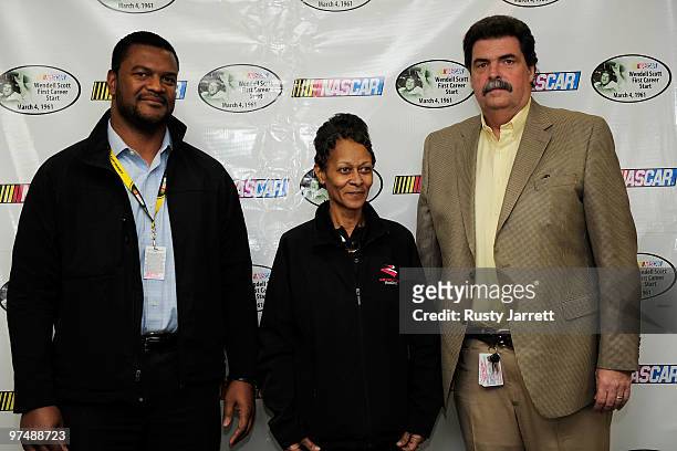 Marcus Jadotte, managing director of public affairs, Sybil Scott, daughter of NASCAR legend Wendell Scott, and NASCAR President Mike Helton pose...