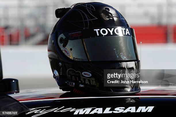 The helmet of Tayler Malsam, driver of the one eighty Toyota, sits atop the truck during qualifying for the NASCAR Camping World Truck Series E-Z-GO...