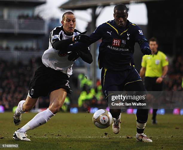 Bobby Zamora of Fulham and Sebastien Bassong of Tottenham Hotspur challenge for the ball during the FA Cup sponsored by E.ON Quarter Final match...