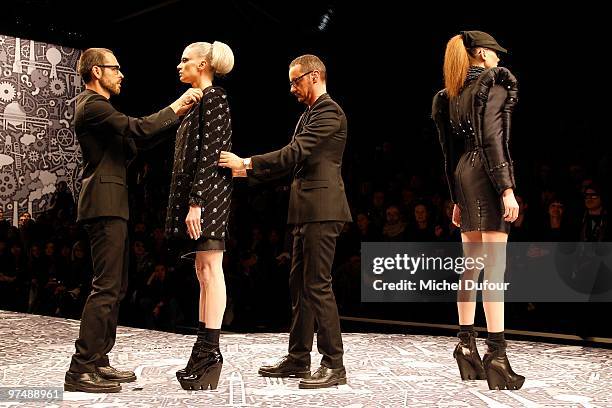 Kristen McMenamy, Viktor & Rolf and a model walk the runway during the Viktor & Rolf Ready to Wear show as part of the Paris Womenswear Fashion Week...