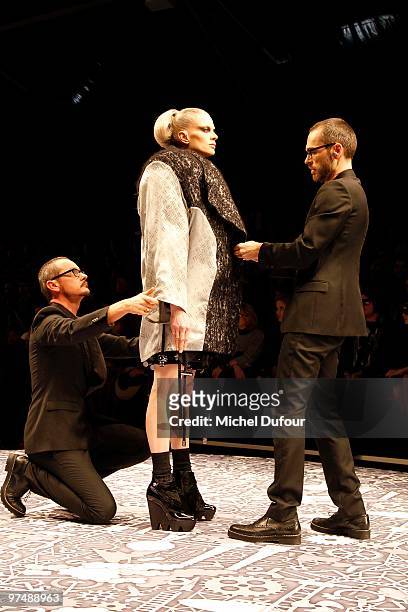 Kristen McMenamy, Viktor & Rolf and a model walk the runway during the Viktor & Rolf Ready to Wear show as part of the Paris Womenswear Fashion Week...