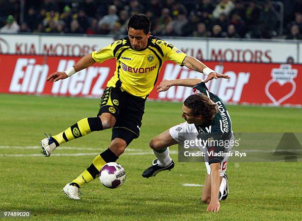 Roel Brouwers of Moenchengladbach tries to stop Lucas Barrios of Dortmund during the Bundesliga match between Borussia Dortmund and Borussia...