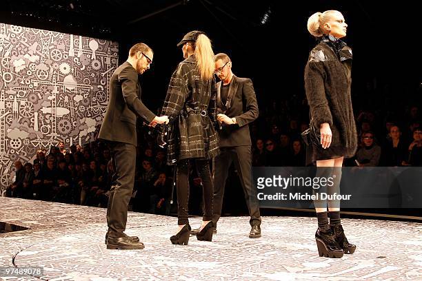 Kristen McMenamy, Viktor & Rolf and a model walk the runway during the Viktor & Rolf Ready to Wear show as part of the Paris Womenswear Fashion Week...