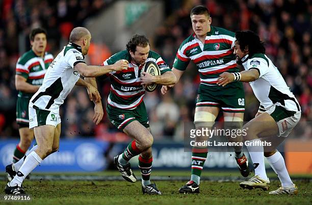 Geordan Murphy of Leicester Tigers is tackled by Paul Hodgson of London Irish during the Guinness Premiership match between Leicester Tigers and...