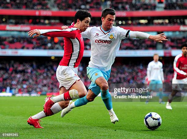 Samir Nasri of Arsenal is challenged by Daniel Fox of Burnley during the Barclays Premier League match between Arsenal and Burnley at Emirates...